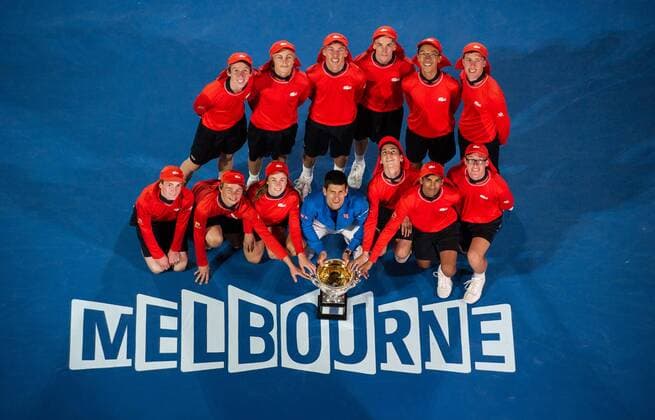 (150201) -- MELBOURNE, Feb. 1, 2015 -- Novak Djokovic (C) of Serbia poses with the trophy and ball kids after winning his men s singles final match at 2015 Australian Open tennis tournament at Melbourne Park in Melbourne, Australia on Feb. 1, 2015. BaixXue 