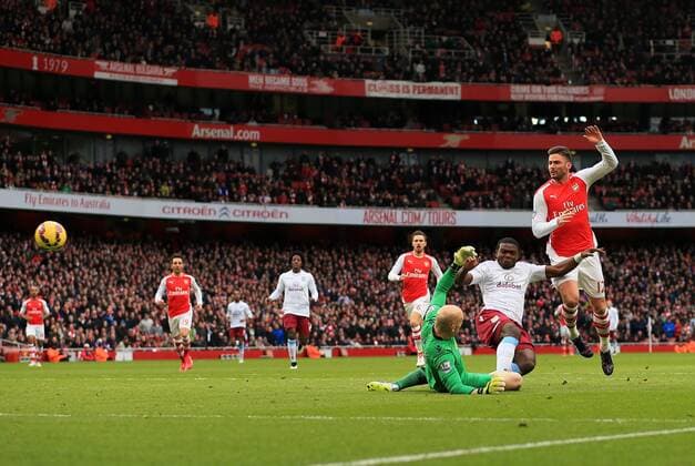 Arsenal s Olivier Giroud scoring his sides opening goal Barclays Premier League - Arsenal vs Aston Villa - Emirates Stadium - England - 1st February 2015 - Picture David Klein Sportimage EDITORIAL USE ONLY. No use with unauthorised audio, video, data, fixture lists, club league logos or live services. Online in-match use limited to 120 images, no video emulation. No use in betting, games or single club league player publications.