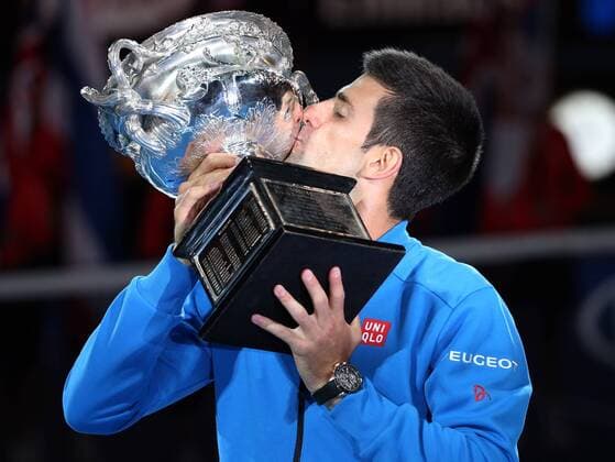 (150201) -- MELBOURNE, Feb. 1, 2015 -- Novak Djokovic of Serbia kisses the trophy after winning his men s singles final match at 2015 Australian Open tennis tournament at Melbourne Park in Melbourne, Australia on Feb. 1, 2015. XuxYanyan 
