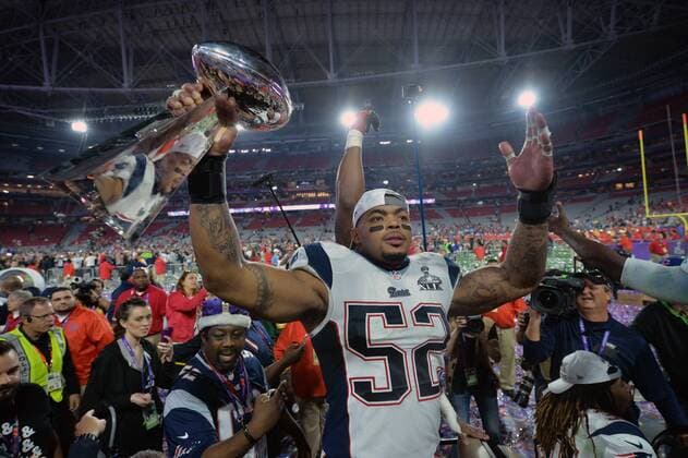 New England Patriots Jonathan Casilas (52) celebrates with the Vince Lombardi Trophy after the Patriots defeated the Seattle Seahawks 28-24 to win Super Bowl XLIX at University of Phoenix Stadium in Glendale, Arizona, February 1, 2015.  SBP20150201120 KEVINxDIETSCH