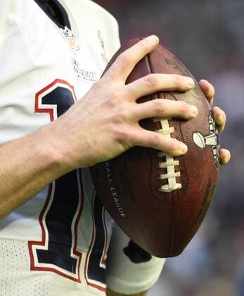 New England Patriots QB Tom Brady holds the football during warm ups to play the Seattle Seahawks in Super Bowl XLIX at University of Phoenix Stadium in Glendale, Arizona, February 1, 2015.  SBP20150201029 KEVINxDIETSCH