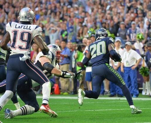 Seattle Seahawks Jeremy Lane (20) runs back an intercepted pass by New England Patriots Tom Brady in the first quarter of Super Bowl XLIX at University of Phoenix Stadium in Glendale, Arizona, February 1, 2015.  SBP20150201047 KEVINxDIETSCH