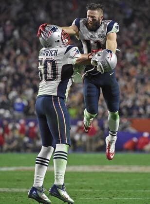 New England Patriots Rob Ninkovich (50) and WR Julian Edelman (R) celebrate a Malcolm Butler interception of a Seattle Seahawks pass with 26 seconds remaining in Super Bowl XLIX at University of Phoenix Stadium in Glendale, Arizona, February 1, 2015. The Patriots won 28-24.  SBP20150201094 KEVINxDIETSCH