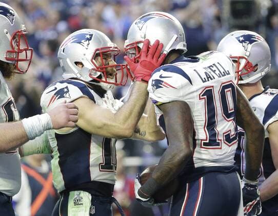 New England Patriots slot receiver Julian Edelman (L) celebrates with wide receiver Brandon LaFell (R) after his 11-yard touchdown pass reception against the Seattle Seahawks in the second quarter of Super Bowl XLIX at University of Phoenix Stadium in Glendale, Arizona, February 1, 2015.  SBP201502013332 JOHNxANGELILLO