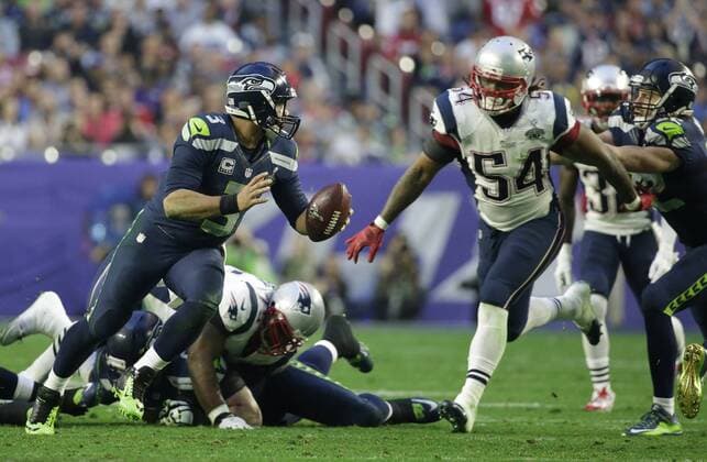 New England Patriots linebacker Don t a Hightower (54) pressures Seattle Seahawks quarterback Russell Wilson during the second quarter of Super Bowl XLIX at University of Phoenix Stadium in Glendale, Arizona, February 1, 2015.  SBP20150201344 JOHNxANGELILLO