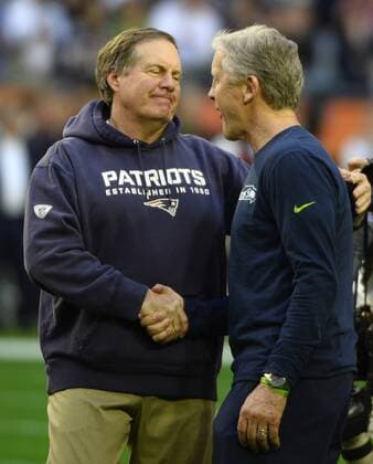 New England Patriots head coach Bill Belichick (L) and Seattle Seahawks head coach Pete Carroll greet each other during pregame activities of Super Bowl XLIX at University of Phoenix Stadium in Glendale, Arizona, February 1, 2015.  SBP20150201607 DAVIDxTULIS