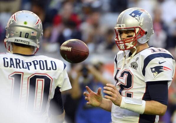 New England Patriots quarterback Tom Brady (12) handles one of the 72 special footballs that were prepared for Super Bowl XLIX during warmups at the University of Phoenix Stadium in Glendale, Arizona, February 1, 2015.  SBP20150201999 DAVIDxTULIS