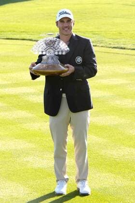 Feb. 1, 2015 - Scottsdale, Arizona, United States - Brooks Koepka holds the trophy after winning the final round of the Waste Management Phoenix Open at TPC at Scottsdale. PGA Golf Herren Golf 2015 - Waste Management Phoenix Open - Final Round - ZUMAw109