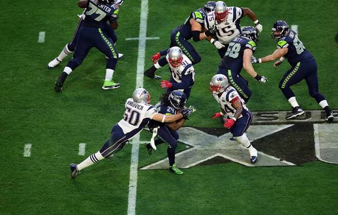 01 February 2015: Seattle Seahawks running back Marshawn Lynch 24 is hit by New England Patriots defensive end Rob Ninkovich 50 during the first half of Super Bowl XLIX between the Seattle Seahawks and the New England Patriots at University of Phoenix Stadium in Glendale, Az. NFL American Football Herren USA FEB 01 Super Bowl XLIX - Patriots v Seahawks Icon3171502010956 EDITORIAL USE ONLY