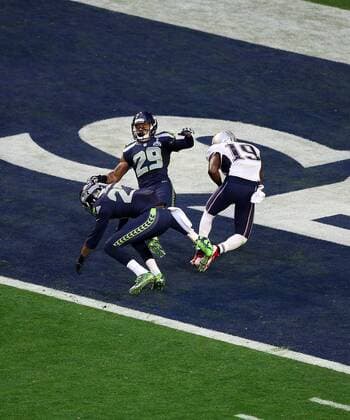 01 February 2015: New England Patriots wide receiver Brandon LaFell 19 is hit by Seattle Seahawks cornerback Tharold Simon 27 (left) and free safety Earl Thomas 29 (right) during the first half of Super Bowl XLIX between the Seattle Seahawks and the New England Patriots at University of Phoenix Stadium in Glendale, Az. NFL American Football Herren USA FEB 01 Super Bowl XLIX - Patriots v Seahawks Icon3171502011375 EDITORIAL USE ONLY