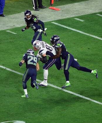 01 February 2015: New England Patriots tight end Rob Gronkowski 87 is hit by Seattle Seahawks free safety Earl Thomas 29 (left) and strong safety Kam Chancellor 31 (right) during the second half of Super Bowl XLIX between the Seattle Seahawks and the New England Patriots at University of Phoenix Stadium in Glendale, Az. The New England Patriots beat the Seattle Seahawks 28-24. NFL American Football Herren USA FEB 01 Super Bowl XLIX - Patriots v Seahawks Icon3171502012920 EDITORIAL USE ONLY