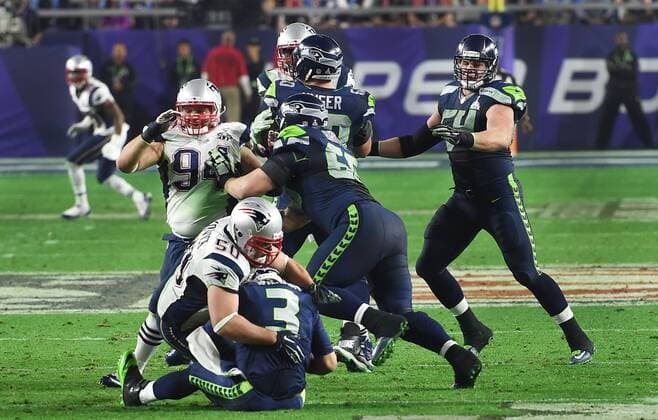 Feb. 1, 2015 - Glendale, Arizona, U.S - New England Patriots defensive end, ROB NINKOVICH, sacks RUSSELL WILSON in the fourth quarter of Super Bowl XLIX. The Patriots went on to win 28-24. NFL American Football Herren USA 2015 - Patriots Win Super Bowl XLIX - ZUMAd50_