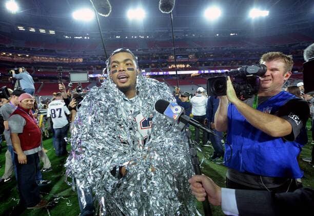New England Patriots linebacker Jonathan Kiko Casillas is interviewed as he is covered in streamers after the Patriots won Super Bowl XLIX at University of Phoenix Stadium in Glendale, Arizona, February 1, 2015. The Patriots defeated the Seattle Seahawks 28-24.  SBP20150201908 KEVINxDIETSCH