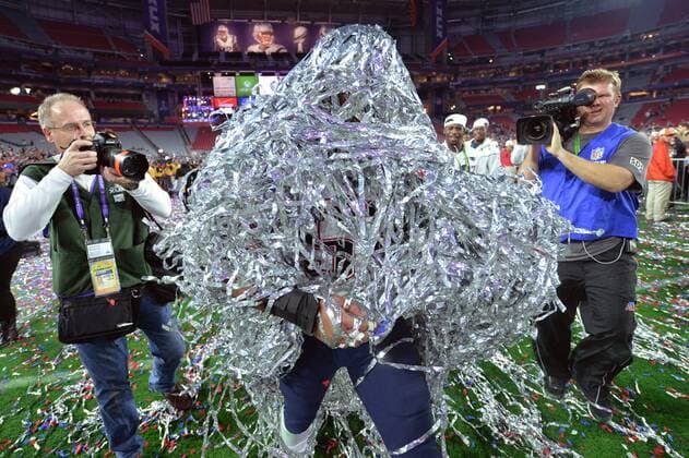 New England Patriots linebacker Jonathan Kiko Casillas walks on the field covered in streamers after the Patriots won Super Bowl XLIX at University of Phoenix Stadium in Glendale, Arizona, February 1, 2015. The Patriots defeated the Seattle Seahawks 28-24.  SBP20150201911r KEVINxDIETSCH