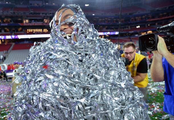 New England Patriots linebacker Jonathan Kiko Casillas walks on the field covered in streamers after the Patriots won Super Bowl XLIX at University of Phoenix Stadium in Glendale, Arizona, February 1, 2015. The Patriots defeated the Seattle Seahawks 28-24.  SBP20150201911 KEVINxDIETSCH
