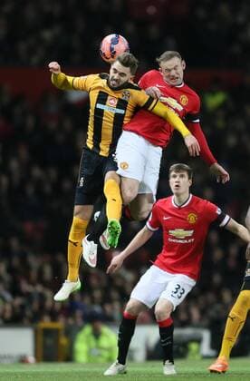 Aktuell Fußball, England, FA Cup, Manchester United - Cambridge United Greg Taylor of Cambridge Utd challenges Wayne Rooney of Manchester United ManU - FA Cup Fourth Round replay - Manchester Utd vs Cambridge Utd - Old Trafford Stadium - Manchester - England - 03rd February 2015 - Picture Simon Bellis Sportimage EDITORIAL USE ONLY. No use with unauthorised audio, video, data, fixture lists, club league logos or live services. Online in-match use limited to 120 images, no video emulation. No use in betting, games or single club league player publications.