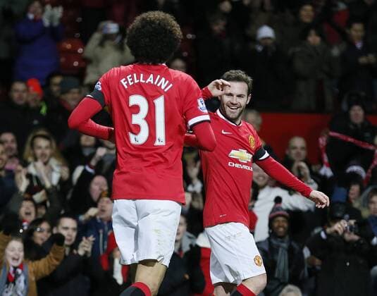 Aktuell Fußball, England, FA Cup, Manchester United - Cambridge United Juan Mata of Manchester United ManU (r) celebrates scoring the first goal - FA Cup Fourth Round replay - Manchester Utd vs Cambridge Utd - Old Trafford Stadium - Manchester - England - 03rd February 2015 - Picture Simon Bellis Sportimage EDITORIAL USE ONLY. No use with unauthorised audio, video, data, fixture lists, club league logos or live services. Online in-match use limited to 120 images, no video emulation. No use in betting, games or single club league player publications.