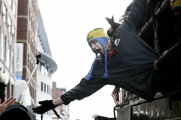 February 4, 2015 - Boston, Massachusetts, U.S. - New England Patriots tight end Rob Gronkowski (87) reaches out to fans during a parade held in Boston to celebrate the team s victory in Super Bowl XLIX. NFL American Football Herren USA 2015: Patriots Super Bowl Victory Parade - ZUMAc04_
