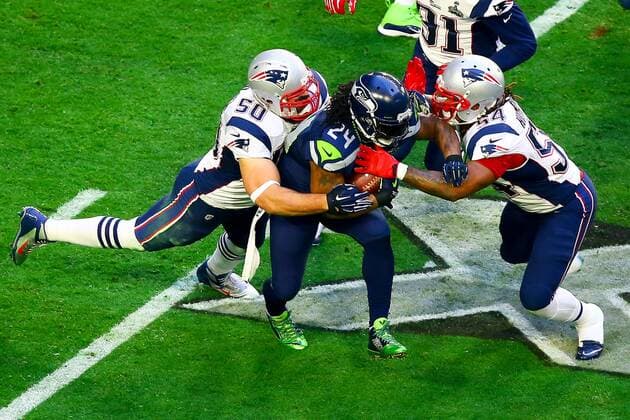 01 FEB 2015: Seattle Seahawks running back Marshawn Lynch (24) gets tackled by New England Patriots defensive end Rob Ninkovich (50) and New England Patriots outside linebacker Dont a Hightower (54) during the first quarter of Super Bowl XLIX being played at University of Phoenix Stadium. The New England Patriots defeat the Seattle Seahawks 28-24 in Super Bowl XLIX at University of Phoenix Stadium in Glendale Arizona. NFL American Football Herren USA FEB 01 Super Bowl XLIX - Patriots v Seahawks Icon020115345 EDITORIAL USE ONLY