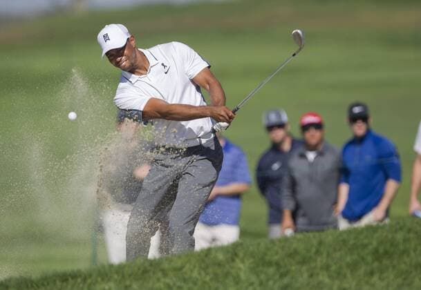 Feb. 5, 2015 - San Diego, California, U.S. - TIGER WOODS swings out of the bunker on the 14th North Course. Woods dropped out of the first round at the Farmers Insurance Open after his back gave him trouble. Golf 2015 - Farmers Insurance Open - Round 1 - ZUMAs44_