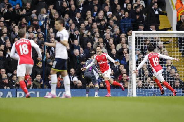 07.02.2015. London, England. Barclays Premier League. Tottenham Hotspur versus Arsenal. Arsenal& x2019;s Mesut Ozil celebrates scoring the opening goal xCraigxMercerx  ActionPlus11595288