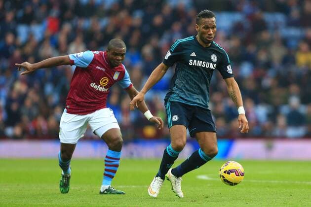 Jores Okore of Aston Villa and Didier Drogba of Chelsea - Aston Villa vs. Chelsea - Barclay s Premier League - Villa Park - Birmingham - 07 02 2015 Pic Philip Oldham Sportimage EDITORIAL USE ONLY. No use with unauthorised audio, video, data, fixture lists, club league logos or live services. Online in-match use limited to 120 images, no video emulation. No use in betting, games or single club league player publications.