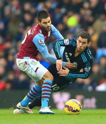 Ashley Westwood of Aston Villa tackles Eden Hazard of Chelsea - Aston Villa vs. Chelsea - Barclay s Premier League - Villa Park - Birmingham - 07 02 2015 Pic Philip Oldham Sportimage EDITORIAL USE ONLY. No use with unauthorised audio, video, data, fixture lists, club league logos or live services. Online in-match use limited to 120 images, no video emulation. No use in betting, games or single club league player publications.