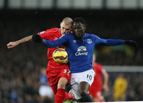 Martin Skrtel of Liverpool tussles with Romelu Lukaku of Everton - Barclays Premier League - Everton vs Liverpool - Goodison Park Stadium - Liverpool - England - 7th February 2015 - Picture Simon Bellis Sportimage EDITORIAL USE ONLY. No use with unauthorised audio, video, data, fixture lists, club league logos or live services. Online in-match use limited to 120 images, no video emulation. No use in betting, games or single club league player publications.