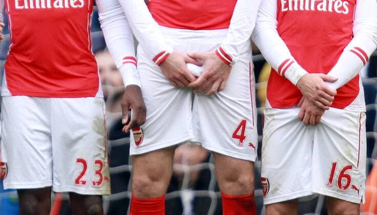 Tottenham Hotspur vs FC Arsenal . . London, UK . . 07.02.15 Eric Dier (TH), Danny Welbeck (A), Per Mertesacker (A), Aaron Ramsey (A) in a defence wall. 