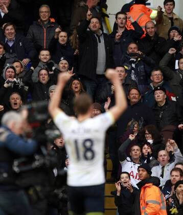Tottenham Hotspur vs FC Arsenal . . London, UK . . 07.02.15 Tottenham fans applaud their hero as Harry Kane (TH) celebrates the victory at the end of the game. 