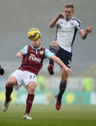 Scott Arfield of Burnley challenged by Darren Fletcher of West Bromwich Albion - Barclays Premier League - Burnley FC vs West Bromwich Albion - Turf Moor Stadium - Burnley - England - 8th February 2015 - EDITORIAL USE ONLY. No use with unauthorised audio, video, data, fixture lists, club league logos or live services. Online in-match use limited to 120 images, no video emulation. No use in betting, games or single club league player publications.