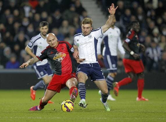 Jonjo Shelvey of Swansea competes with James Morrison of West Brom (right) - Premier League Football - West Bromwich Albion vs Swansea City - The Hawthorns West Bromwich - Season 2014 15 - 11th February 2015 - Photo Malcolm Couzens Sportimage EDITORIAL USE ONLY. No use with unauthorised audio, video, data, fixture lists, club league logos or live services. Online in-match use limited to 120 images, no video emulation. No use in betting, games or single club league player publications.