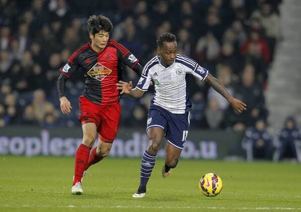 Saido Berahino of West Brom races away from Ki Sung Yeung of Swansea - Premier League Football - West Bromwich Albion vs Swansea City - The Hawthorns West Bromwich - Season 2014 15 - 11th February 2015 - Photo Malcolm Couzens Sportimage EDITORIAL USE ONLY. No use with unauthorised audio, video, data, fixture lists, club league logos or live services. Online in-match use limited to 120 images, no video emulation. No use in betting, games or single club league player publications.