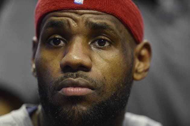 Cleveland Cavaliers forward LeBron James sits on the bench during the first quarter against the Chicago Bulls at the United Center on February 12, 2015 in Chicago.  CHI20150212111 BRIANxKERSEY