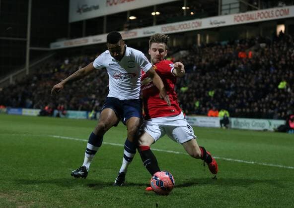 Chris Humphrey of Preston North End out muscles Luke Shaw of Manchester United ManU - FA Cup Fifth Round - Preston North End vs Manchester Utd - Deepdale Stadium - Preston - England - 16th February 2015 - Picture Simon Bellis Sportimage EDITORIAL USE ONLY. No use with unauthorised audio, video, data, fixture lists, club league logos or live services. Online in-match use limited to 120 images, no video emulation. No use in betting, games or single club league player publications.