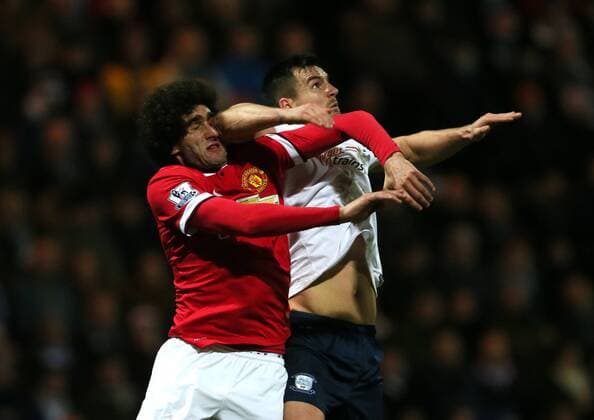 Mauroane Fellaini of Manchester United ManU is elbowed in the face by Bailey Wright of Preston North End - FA Cup Fifth Round - Preston North End vs Manchester Utd - Deepdale Stadium - Preston - England - 16th February 2015 - Picture Simon Bellis Sportimage EDITORIAL USE ONLY. No use with unauthorised audio, video, data, fixture lists, club league logos or live services. Online in-match use limited to 120 images, no video emulation. No use in betting, games or single club league player publications.