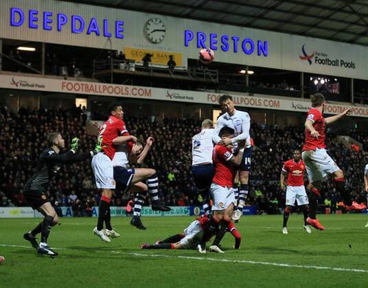 Preston s Joe Garner tussles with Manchester United ManU s Marcos Rojo FA Cup - Preston North End vs Manchester United - Deepdale - England - 16th February 2015 - Picture David Klein Sportimage EDITORIAL USE ONLY. No use with unauthorised audio, video, data, fixture lists, club league logos or live services. Online in-match use limited to 120 images, no video emulation. No use in betting, games or single club league player publications.