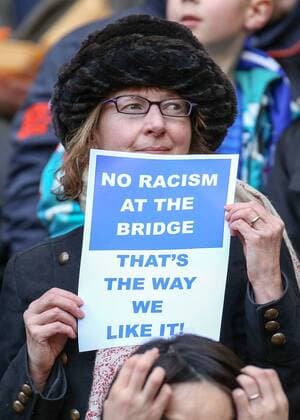 21.02.2015. London, England. Barclays Premier League. A FC Chelsea fan holds up an anti racism poster before the match  CHE_BUR