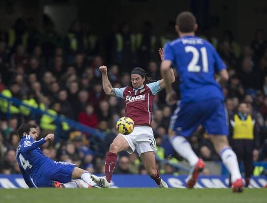 21.02.2015. London, England. Barclays Premier League. Chelsea versus Burnley. Burnley s George Boyd goes in for the challenge with Chelsea s Cesc F& xe0;bregas. xNigelxCookex  ActionPlus11599326