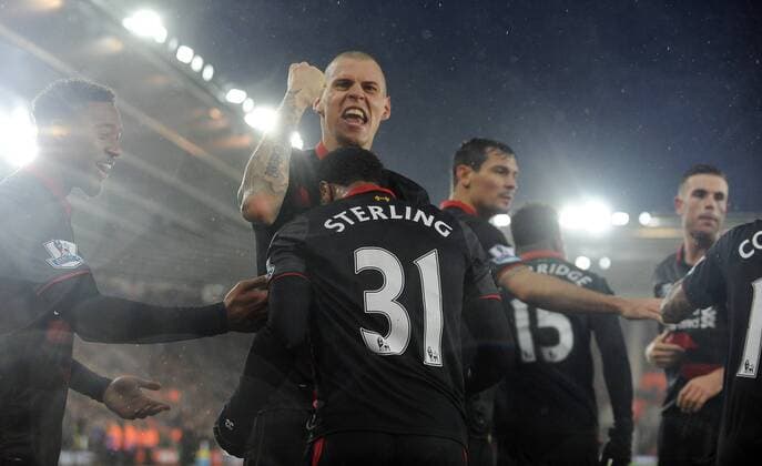 Raheem Sterling of Liverpool celebrates scoring his goal to make it 2-0 with team mate Martin Skrtel of Liverpool - Barclays Premier League - Southampton vs Liverpool - St Mary s Stadium - Southampton - England - 22nd February 2015 - Pic Robin Parker Sportimage EDITORIAL USE ONLY. No use with unauthorised audio, video, data, fixture lists, club league logos or live services. Online in-match use limited to 120 images, no video emulation. No use in betting, games or single club league player publications. DSC_7354.JPG