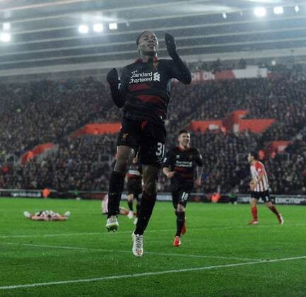 Raheem Sterling of Liverpool celebrates scoring his goal to make it 2-0 - Barclays Premier League - Southampton vs Liverpool - St Mary s Stadium - Southampton - England - 22nd February 2015 - Pic Robin Parker Sportimage EDITORIAL USE ONLY. No use with unauthorised audio, video, data, fixture lists, club league logos or live services. Online in-match use limited to 120 images, no video emulation. No use in betting, games or single club league player publications. DSC_7354.JPG