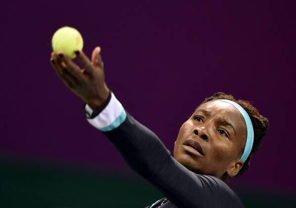 (150224) -- DOHA, Feb. 23, 2015 -- Venus Williams of the United States serves during the first round match against CaseyDellacqua of Australia in the WTA Tennis Damen Qatar Open tennis tournament in Doha, Qatar, Feb. 23, 2015. Venus Williams won 2-1. ) (SP)QATAR-DOHA-TENNIS-WTA ChenxShaojin 