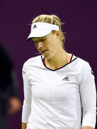 (150224) -- DOHA, Feb. 23, 2015 -- Angelique Kerber of Germany reacts during the first round match against VictoriaAzarenka of Belarus in the WTA Tennis Damen Qatar Open tennis tournament in Doha, Qatar, Feb. 23, 2015. Angelique Kerber lost 0-2. ) (SP)QATAR-DOHA-TENNIS-WTA ChenxShaojin 