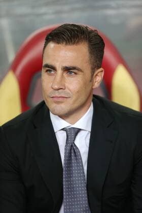 Fabio Cannavaro, the new head coach of Guangzhou Evergrande Taobao FC, watches his players competing against FC Seoul during their Group H 1st round of the AFC Champions League 2015 in Guangzhou city 25 February 2015.  20150225_66585