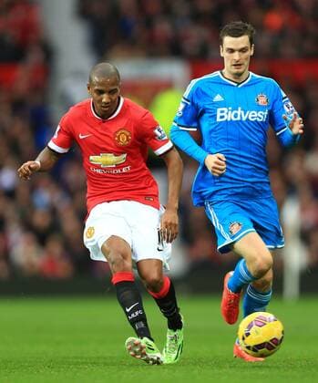 Adam Johnson of Sunderland chases Ashley Young of Manchester United ManU - Manchester United (ManU) vs. AFC Sunderland - Barclay s Premier League - Old Trafford - Manchester - 28 02 2015 EDITORIAL USE ONLY. No use with unauthorised audio, video, data, fixture lists, club league logos or live services. Online in-match use limited to 120 images, no video emulation. No use in betting, games or single club league player publications.