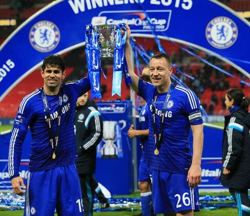 Chelsea s Diego Costa and John Terry celebrate with the trophy League Cup Final - Chelsea vs Tottenham Hotspur - Wembley Stadium - England - 1st March 2015 - Picture David Klein Sportimage EDITORIAL USE ONLY. No use with unauthorised audio, video, data, fixture lists, club league logos or live services. Online in-match use limited to 120 images, no video emulation. No use in betting, games or single club league player publications.
