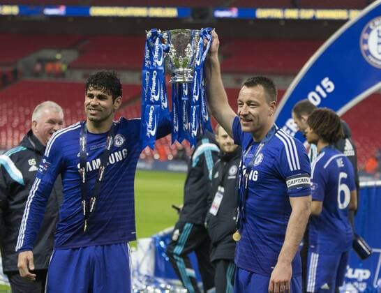 01.03.2015. London, England. Capital One Cup Final. Chelsea versus Tottenham Hotspur. Chelsea s Diego Costa and John Terry, who each scored a goal in their sides 2-0 win, hold the trophy at the final whistle. xNigelxCookex  ActionPlus11601978