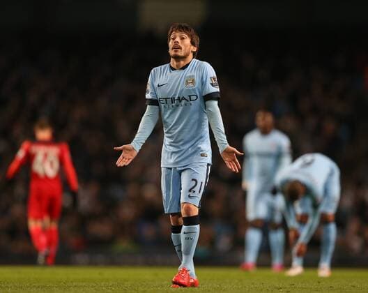 David Silva of Manchester City holds out his arms defence as Sergio Kun Aguero of Manchester City questions his pass - Barclays Premier League - Manchester City vs Leicester City - Etihad Stadium - Manchester - England - 4th March 2015 - Picture Simon Bellis Sportimage EDITORIAL USE ONLY. No use with unauthorised audio, video, data, fixture lists, club league logos or live services. Online in-match use limited to 120 images, no video emulation. No use in betting, games or single club league player publications.