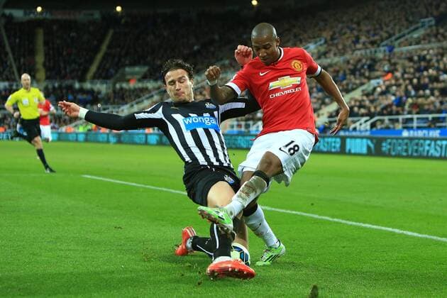 Daryl Janmaat of Newcastle United tackles Ashley Young of Manchester United ManU - Newcastle United vs. Manchester United - Barclay s Premier League - St James Park - Newcastle - 04 03 2015 Pic Philip Oldham Sportimage EDITORIAL USE ONLY. No use with unauthorised audio, video, data, fixture lists, club league logos or live services. Online in-match use limited to 120 images, no video emulation. No use in betting, games or single club league player publications.