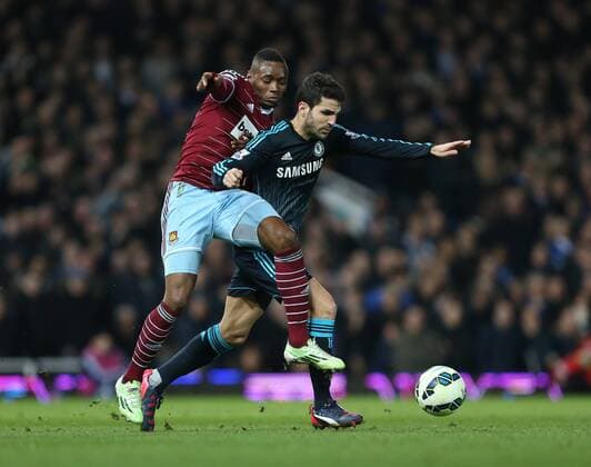 West Ham s Diafra Sakho tussles with Chelsea s Cesc Fabregas Barclays Premier League - - West Ham United vs FC Chelsea United - Upton Park - England - 4th March 2015 - Picture DavidxKlein Sportimage EDITORIAL USE ONLY. No use with unauthorised audio, video, data, fixture lists, club league logos or live services. Online in-match use limited to 120 images, no video emulation. No use in betting, games or single club league player publications.